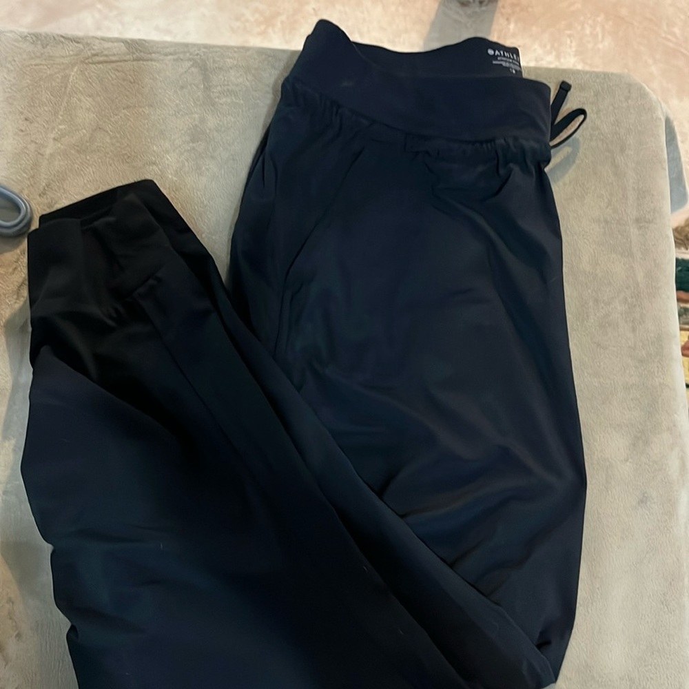 Athleta black nylon sweats with gathered side detail!  Size 12.
